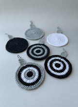 Load image into Gallery viewer, Crocheted coasters with circular patterns on a wooden surface