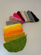 Load image into Gallery viewer, Set of colorful crocheted glasses cover with a hanger hanging on a white surface.