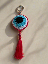 Load image into Gallery viewer, Black cyan white red crochet protection eye key chain