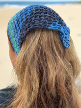 Load image into Gallery viewer, Blue crochet headband worn by a person with long blonde hair, outdoor setting