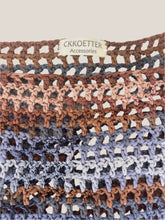 Load image into Gallery viewer, Close-up of a crocheted fabric with a CKKoetter Accessories label, featuring brown, pink, and blue patterns.