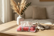 Load image into Gallery viewer, Tissue holder with pink and gray crochet design on a dark background