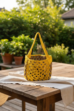 Load image into Gallery viewer, Yellow and brown crocheted bag on a table