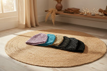 Load image into Gallery viewer, Six crocheted hats in different colors arranged on a wooden surface.