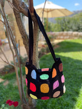 Load image into Gallery viewer, Colorful polka dot bag hanging on a tree branch outdoors