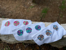 Load image into Gallery viewer, White towels with floral patterns on a stone surface