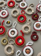 Load image into Gallery viewer, Collection of decorative Christmas ornaments on a wooden surface