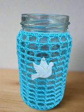 Load image into Gallery viewer, Glass jar with a blue net cover and white dove ornament on a neutral background