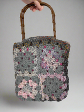 Load image into Gallery viewer, Handmade crochet bag with a wooden handle on a gray background