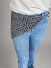Load image into Gallery viewer, Person wearing blue jeans with a textured pattern on a white surface.