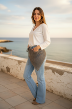 Load image into Gallery viewer, Person wearing a textured gray shawl over a white shirt and blue jeans on a plain background