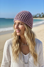 Load image into Gallery viewer, Woman with blond hair wearing a pink shimmery crochet mesh hat