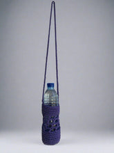 Load image into Gallery viewer, Purple crocheted bottle holder with a water bottle on a gray background