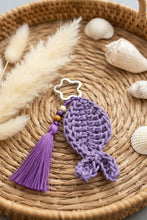 Load image into Gallery viewer, Purple crocheted fishwith star-shaped metal clip on a gray background