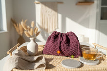 Load image into Gallery viewer, Knitted bag with colorful beads on a stone surface