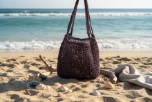 Load image into Gallery viewer, Purple crochet bag with sea as a background