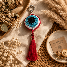 Load image into Gallery viewer, Black cyan white red crochet protection eye key chain