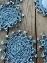 Load image into Gallery viewer, Round crochet cotton gray coasters with silver stars