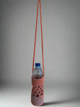 Load image into Gallery viewer, Knitted water bottle holder with a water bottle on a white surface