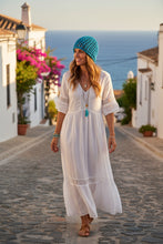 Load image into Gallery viewer, woman wearing a turquoise crochet mesh hat
