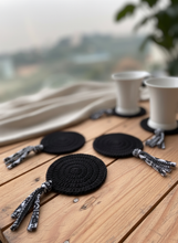 Load image into Gallery viewer, Black Crochet Coasters with Subtle Lifestyle Background