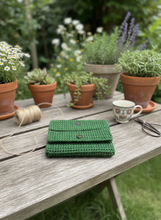Load image into Gallery viewer, Green crochet wallet in natural setting