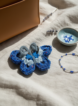 Load image into Gallery viewer, Lifestyle background with butterfly bag charm