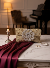 Load image into Gallery viewer, Lifestyle background with gold crochet clutch