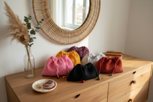 Load image into Gallery viewer, Lifestyle image of 6 colorful crochet dust bags