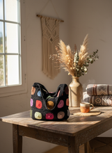 Load image into Gallery viewer, Lifestyle scene with crochet tote bag