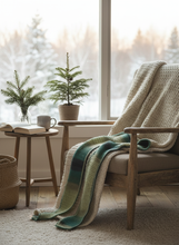 Load image into Gallery viewer, Lifestyle scene with green crochet winter scarf