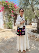 Load image into Gallery viewer, Woman carrying crochet tote bag