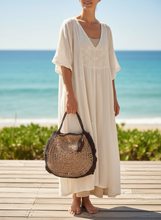 Load image into Gallery viewer, Woman holding Brown & Beige Crochet Raffia Summer Bag with correct handle length