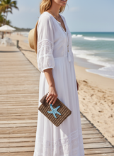 Load image into Gallery viewer, Woman Holding Brown Crochet Pouch at Beach