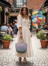 Load image into Gallery viewer, Woman holding colorful granny squares bag