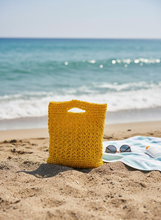 Load image into Gallery viewer, Yellow raffia bag on beach