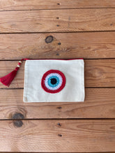 Load image into Gallery viewer, White Canva Pouches with a Cotton Crochet Evil Eye Applique and a Tassel
