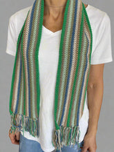 Load image into Gallery viewer, Person holding a striped woven mat with green, brown, and blue colors.
