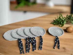 Round Greige Crochet Coasters with Lycra Tassels Black with White Stars