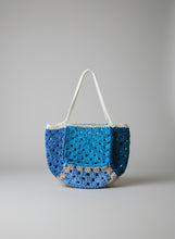 Load image into Gallery viewer, Crocheted bag with blue and gray pattern on a white background
