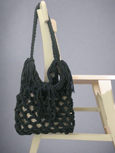 Load image into Gallery viewer, Blue crochet bag with tassels on a wooden chair 
