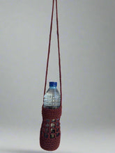 Load image into Gallery viewer, Maroon woven bottle holder with a water bottle on a plain background

