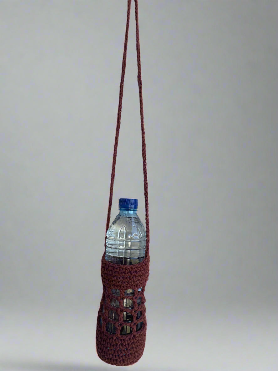 Maroon woven bottle holder with a water bottle on a plain background