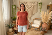 Load image into Gallery viewer, Person wearing a rust-colored sleeveless top with a boho background
