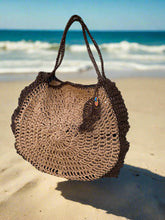 Load image into Gallery viewer, Brown woven bag on a metal chair with a light gray floor background
