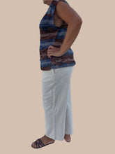 Load image into Gallery viewer, Person wearing a patterned dress and sandals on a tiled floor.
