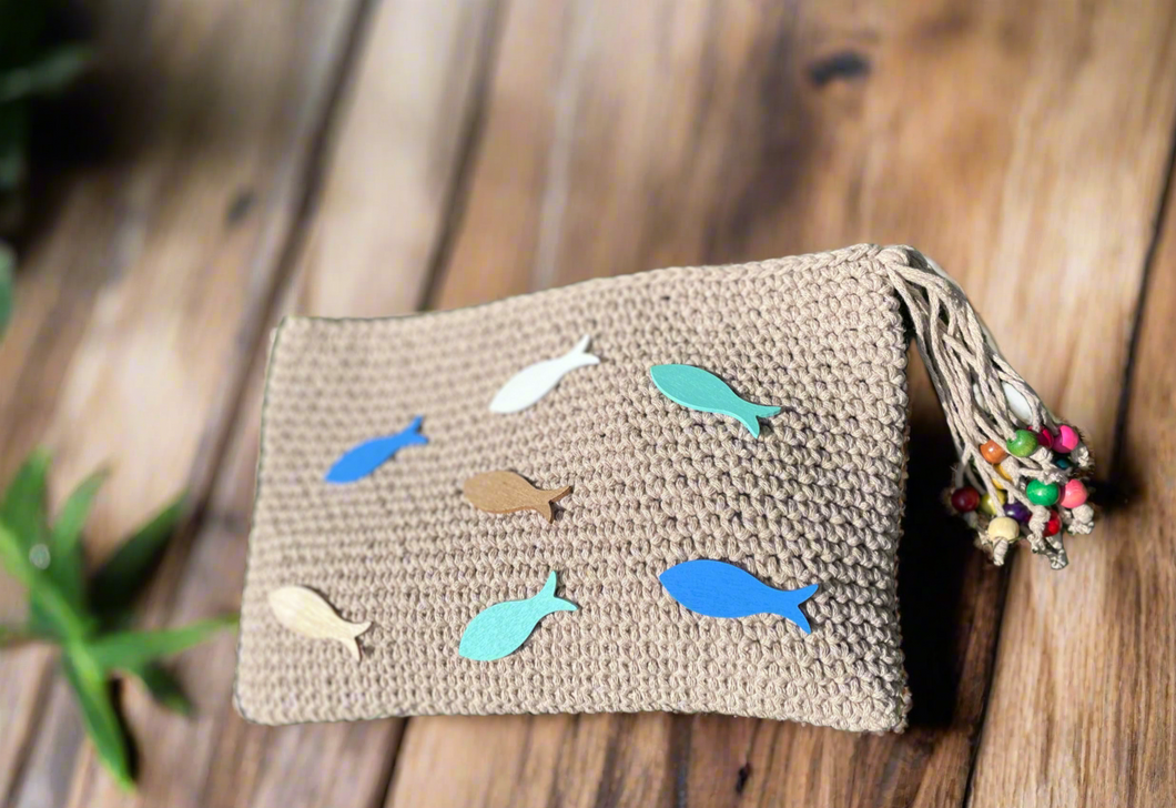 Handmade bag with fish patterns on a wooden surface