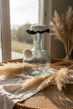 Load image into Gallery viewer, Clear water jug Lebanese ibriq with a white and black crochet cover on a gray surface
