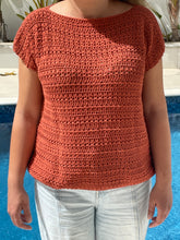 Load image into Gallery viewer, Person wearing a brown knitted sleeveless top with light blue jeans by a pool.
