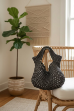 Load image into Gallery viewer, Woven brown bag on a chair
